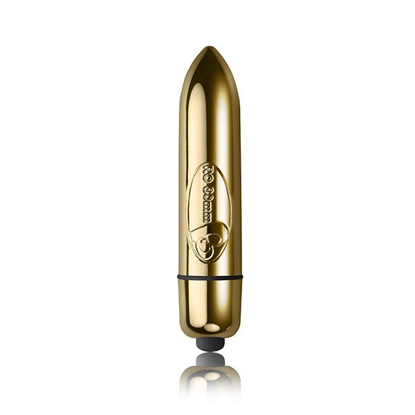 The image shows a black silicone T-shaped base and a golden bullet vibrator, indicating the kit includes these items for couple's pleasure.
