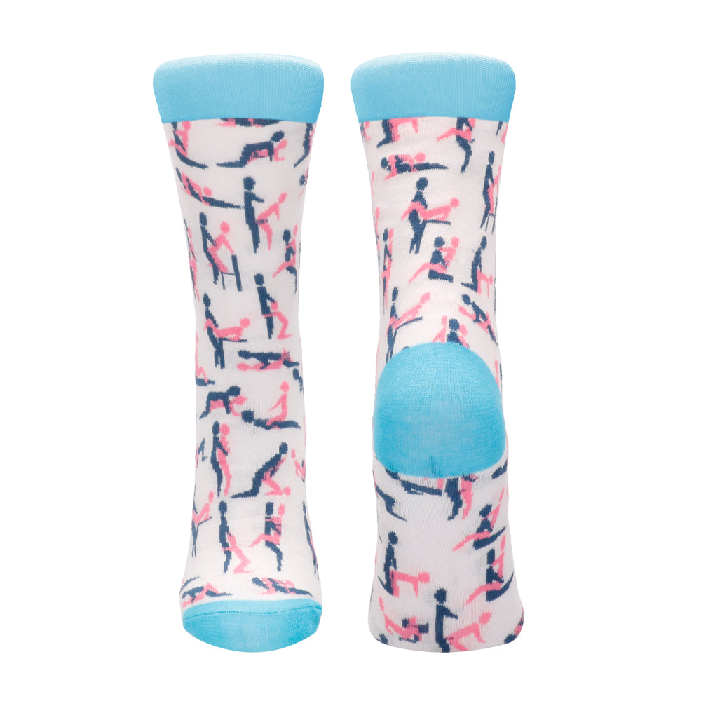 A pair of white socks with a geometric pattern, featuring blue tips and heels.