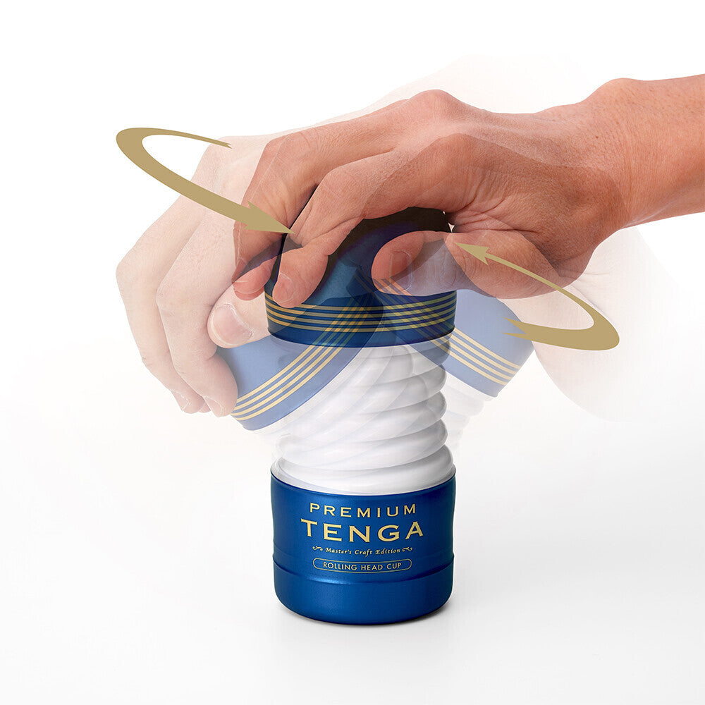 Tenga product with a hand holding it on a white background