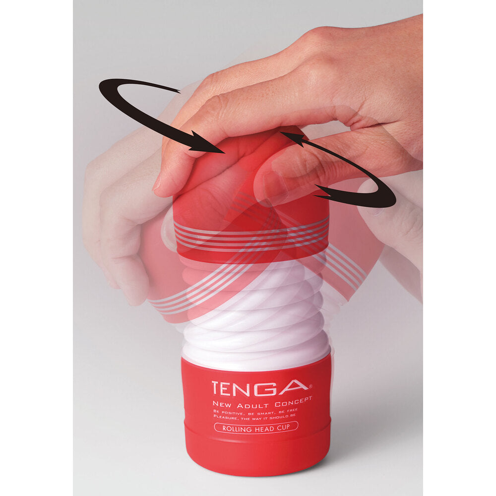 Red Tenga product with a hand holding it on a light gray background