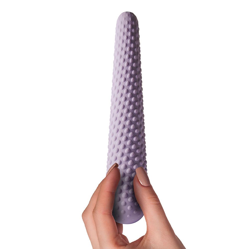 A set of three purple silicone dilators of varying sizes, each with a textured surface.