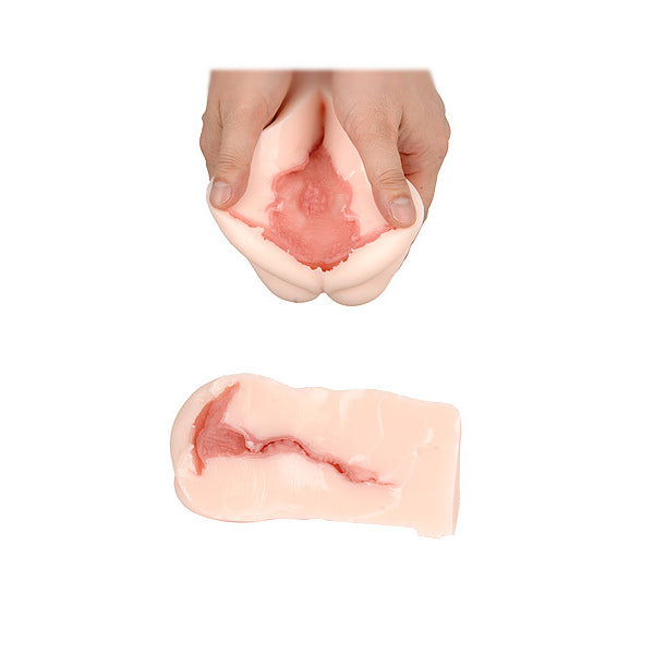 A flesh-pink colored masturbator with a complex textured interior designed to mimic the female genitalia, featuring an autograph on the exterior.