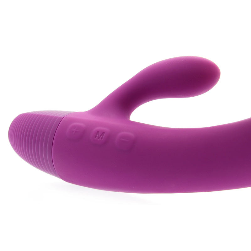 Purple silicone wand with control buttons on a white background