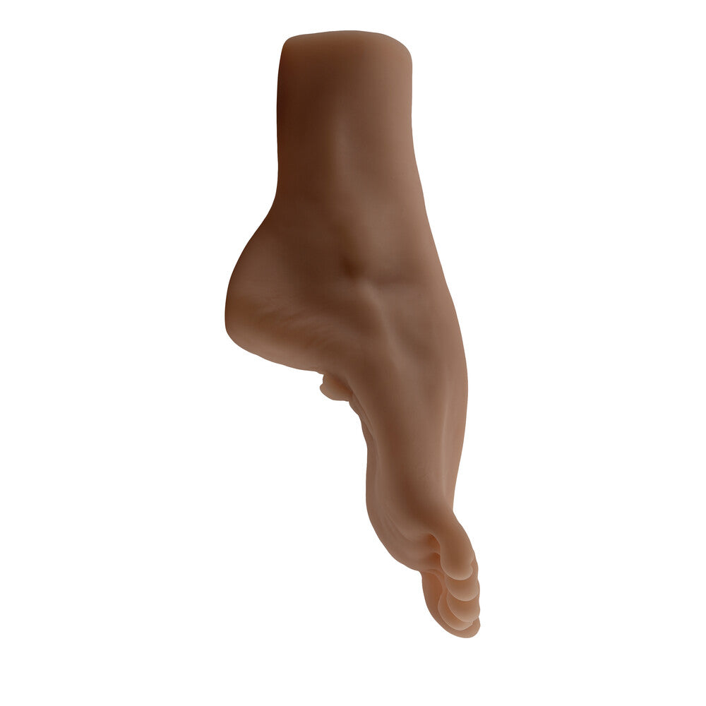 Beige-colored plastic mold of a foot on a white background