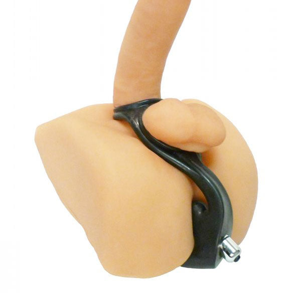 Hand holding a black ring with a white background