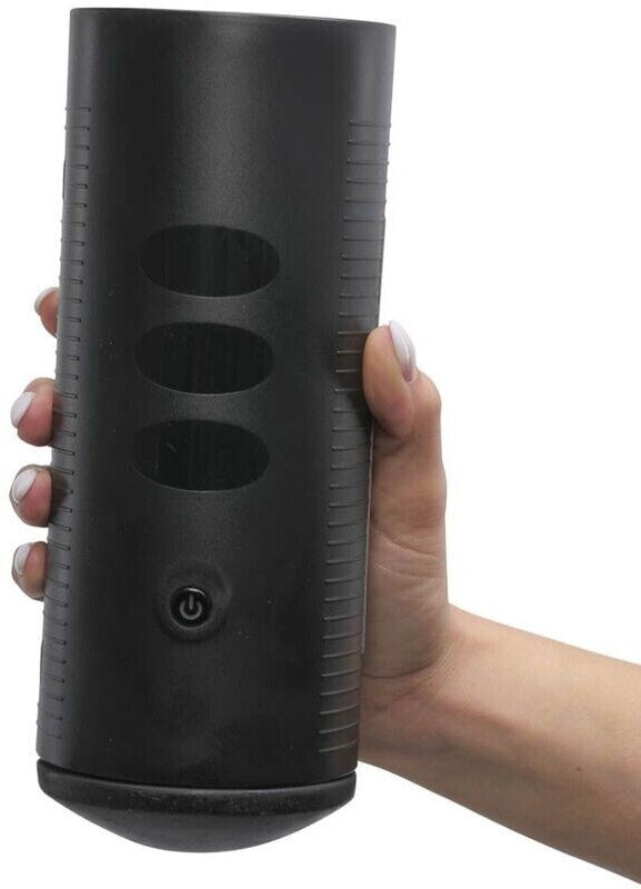 Black cylindrical device held by a hand on a white background