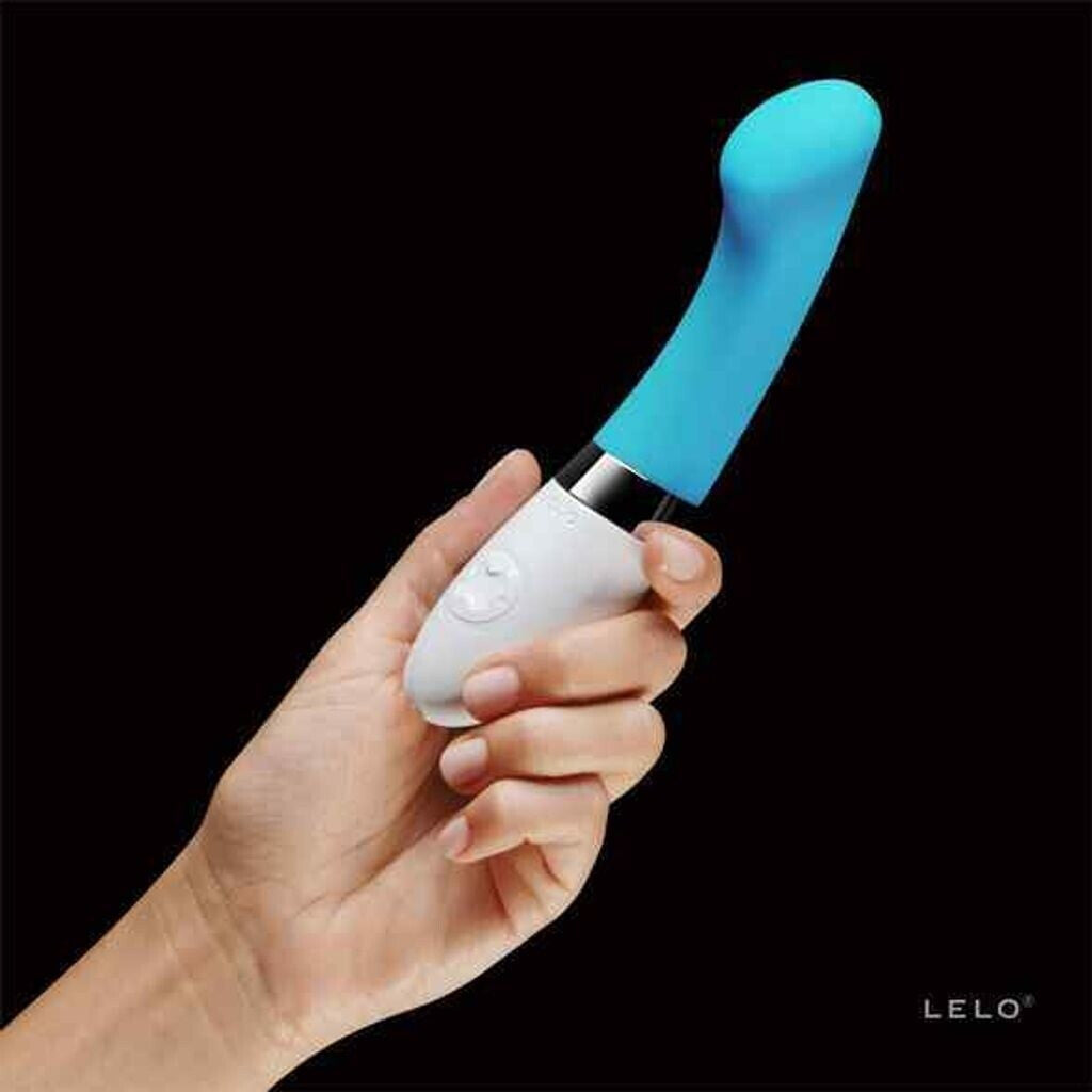 Hand holding a white and blue electronic device with 'LELO' branding on a black background