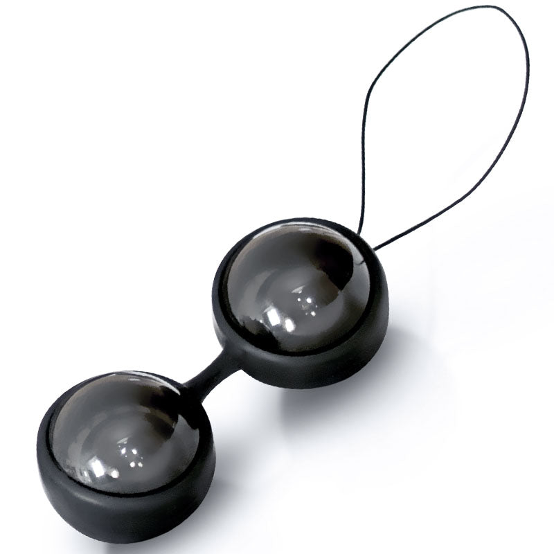 Black and gray toy with a string on a white background