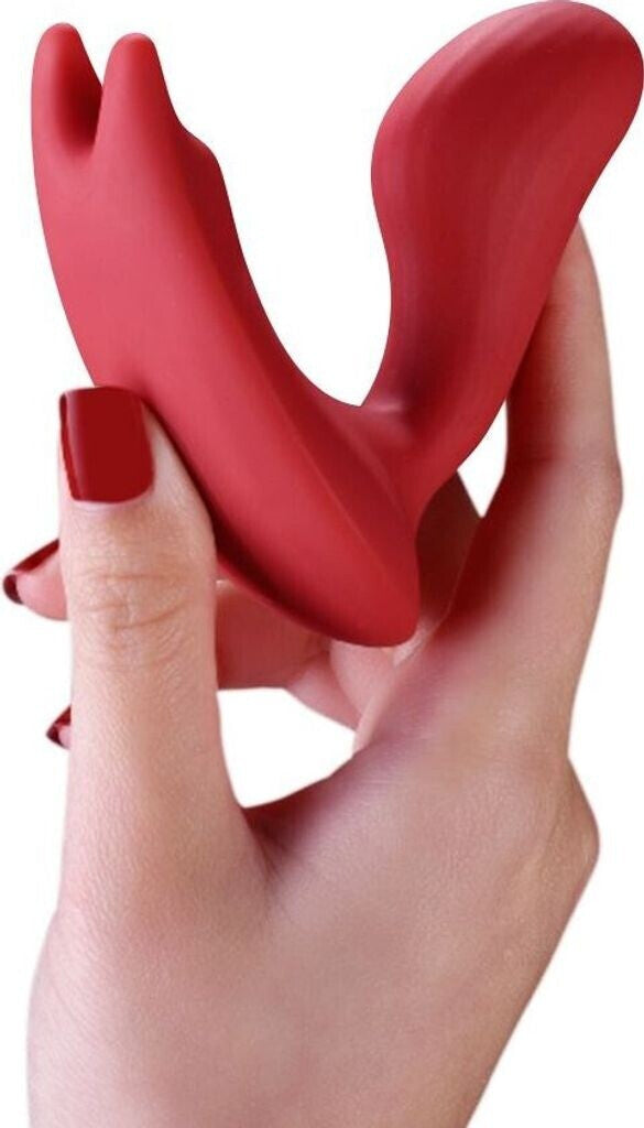 Red silicone ring held by a hand with red nail polish on a white background