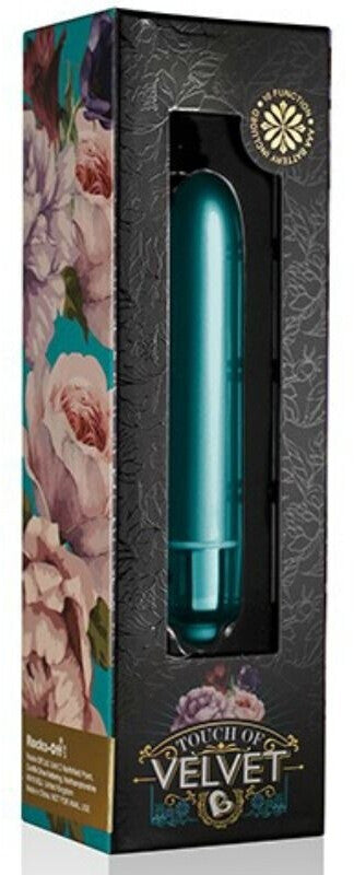 Teal product in a decorative box with floral designs and 'Touch of Velvet' branding.