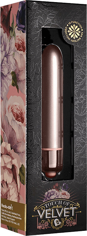 Rose gold cylindrical product in a decorative box with floral design