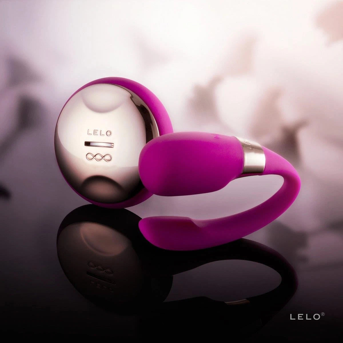 Purple and silver device with 'LELO' branding on a reflective surface.