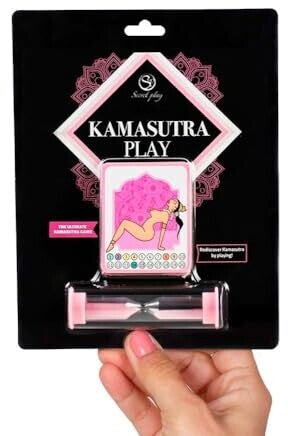 Kamasutra Play product packaging held by a hand with pink nail polish.