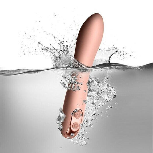 A baby pink personal massager with a smooth, tapered design and two buttons on the base for control. Made from silicone, it is firm yet flexible and appears to be USB rechargeable.