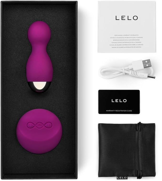 Purple electronic device with accessories on a white background, featuring the Lelo brand.