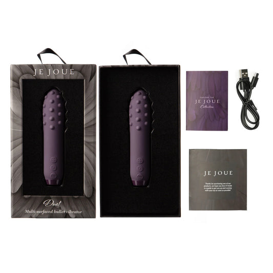 A purple, bullet-shaped vibrator with a textured, multi-surfaced tip and control buttons near the base.
