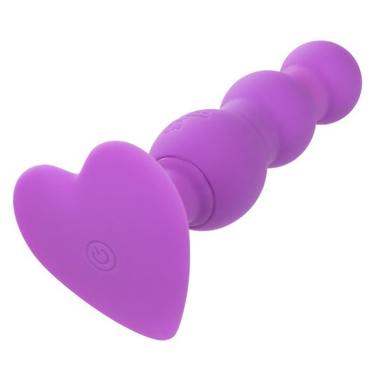 Purple silicone butt plug on a white background