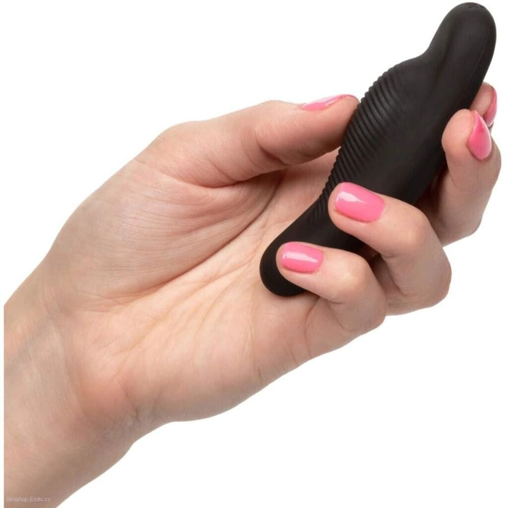 Hand holding a black object with pink nail polish on a white background