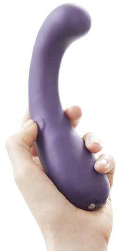 Purple handheld device held in a hand against a white background