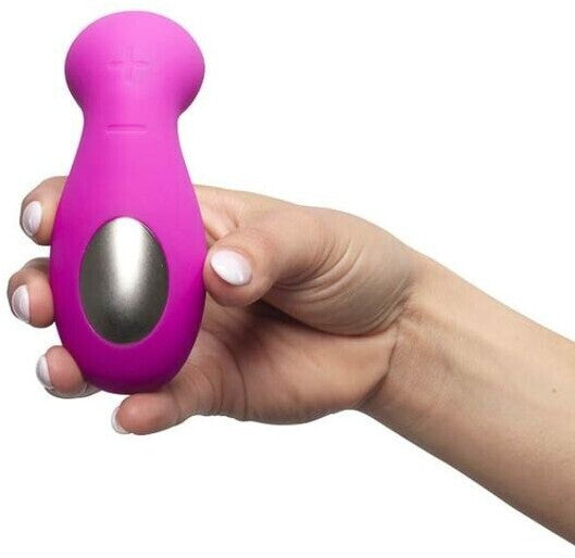 Hand holding a pink and silver device against a white background