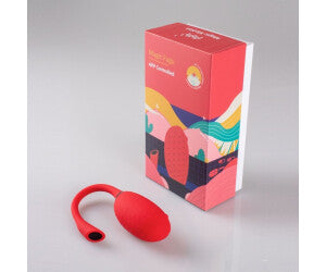 Red silicone bulb with colorful packaging on a gray background