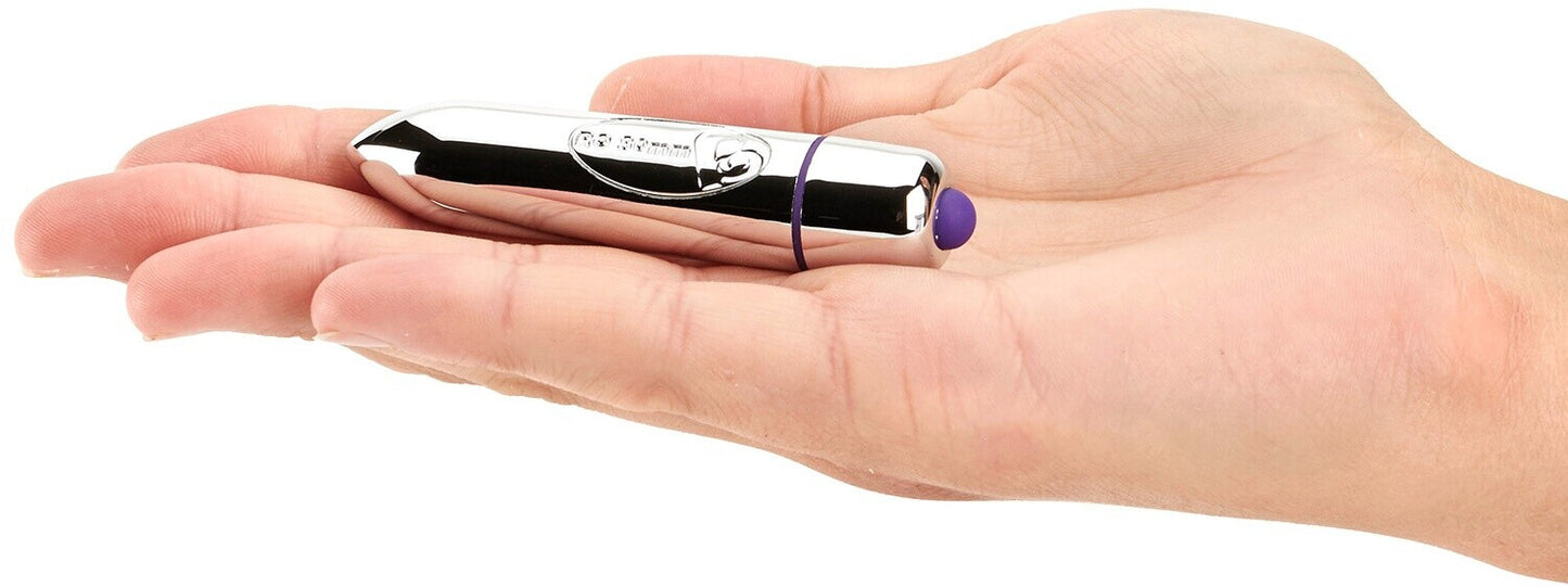 Small electronic device held in a hand against a white background