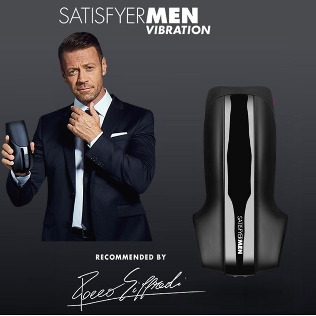 Man in a suit holding a Satisfyer Men Vibration product with the brand name displayed.